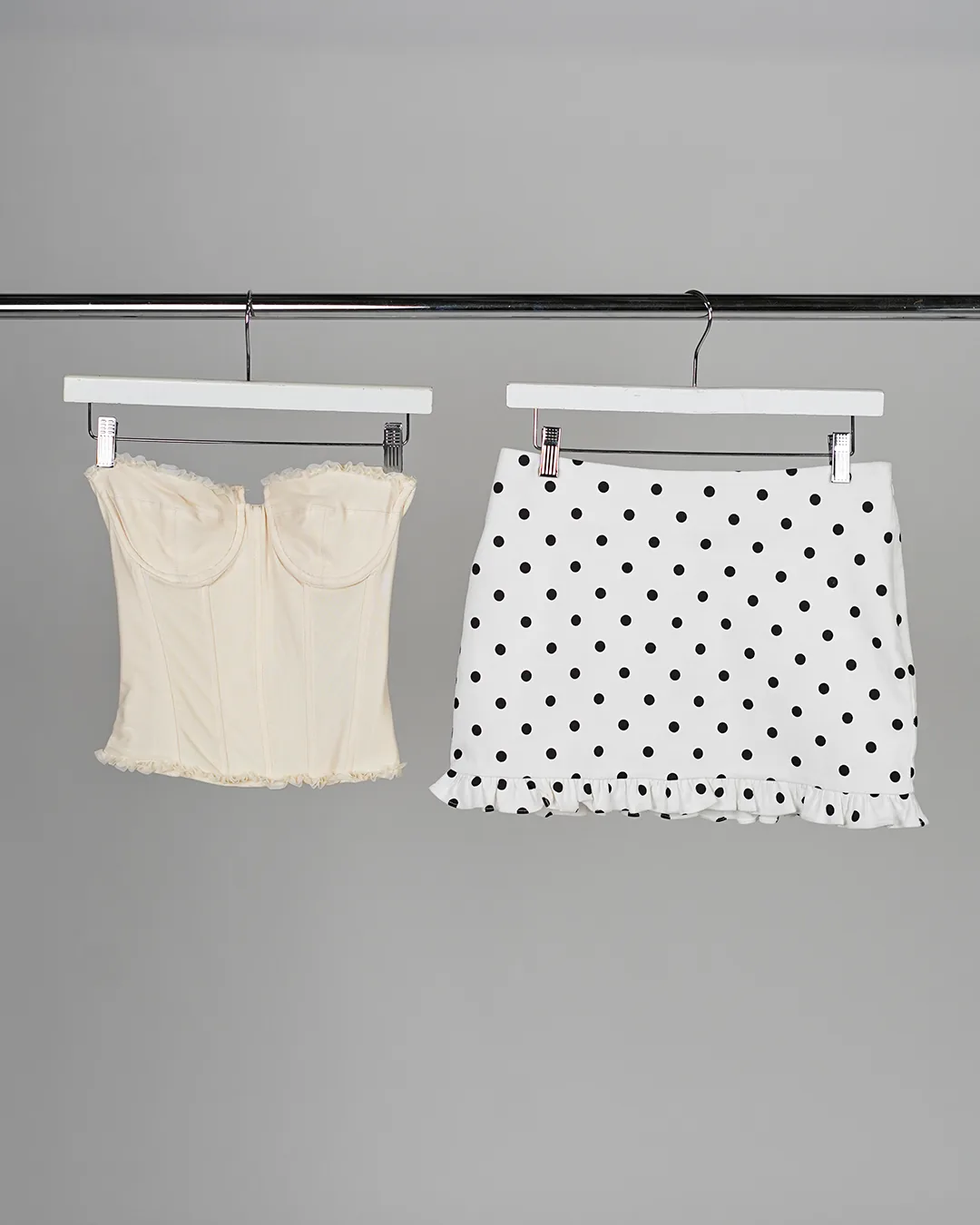 Studio shot of top and skirt on hangers